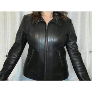 Vintage 90's black leather jacket, buttery soft with cool seams and zippers.